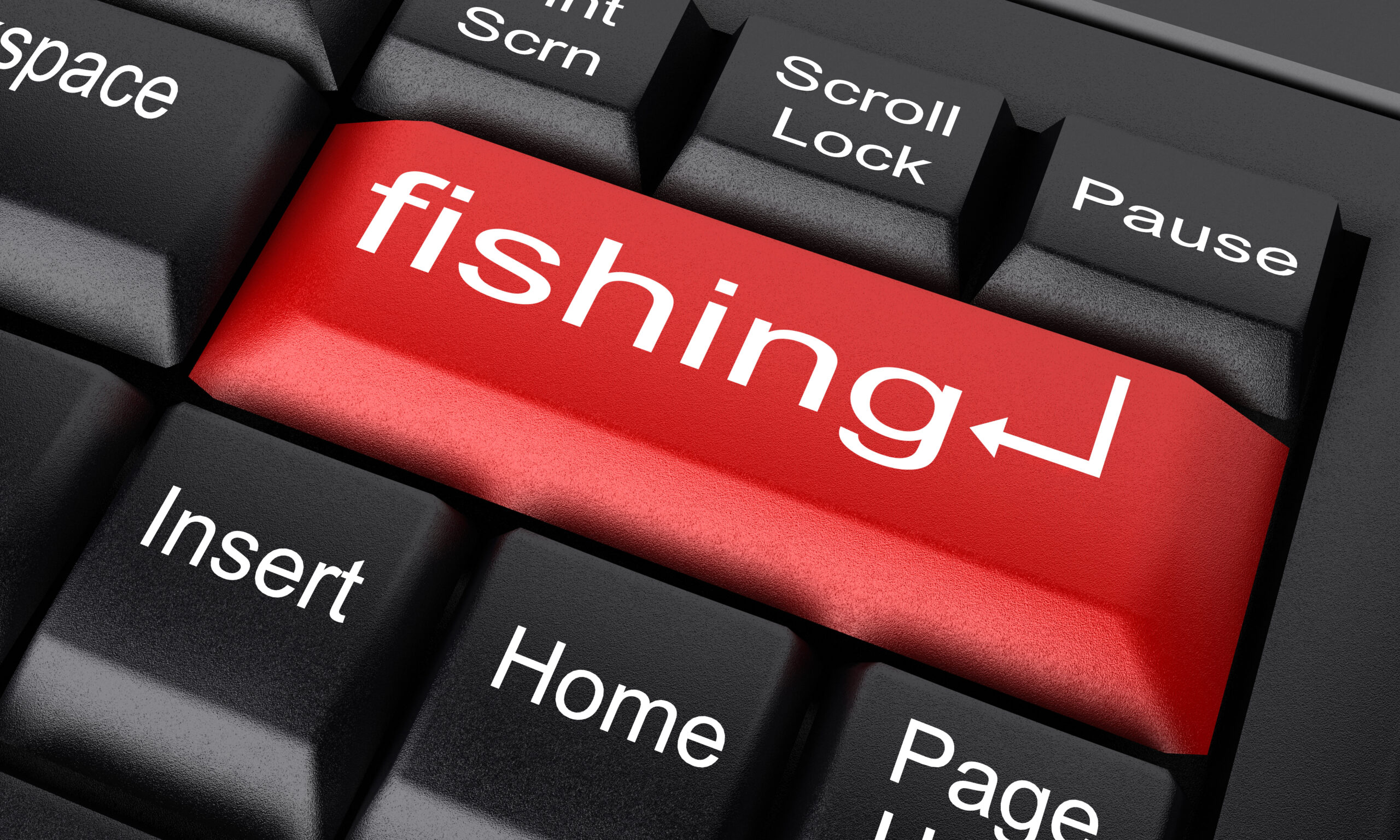 A close-up of a keyboard with a red 'fishing' key, symbolizing phishing cyberattacks.